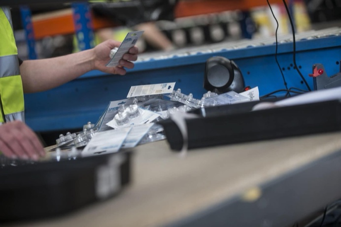 A Pro FS team member scanning a parcel on the packing line