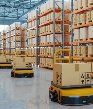 Yellow automated carts carrying parcels down a warehouse aisle